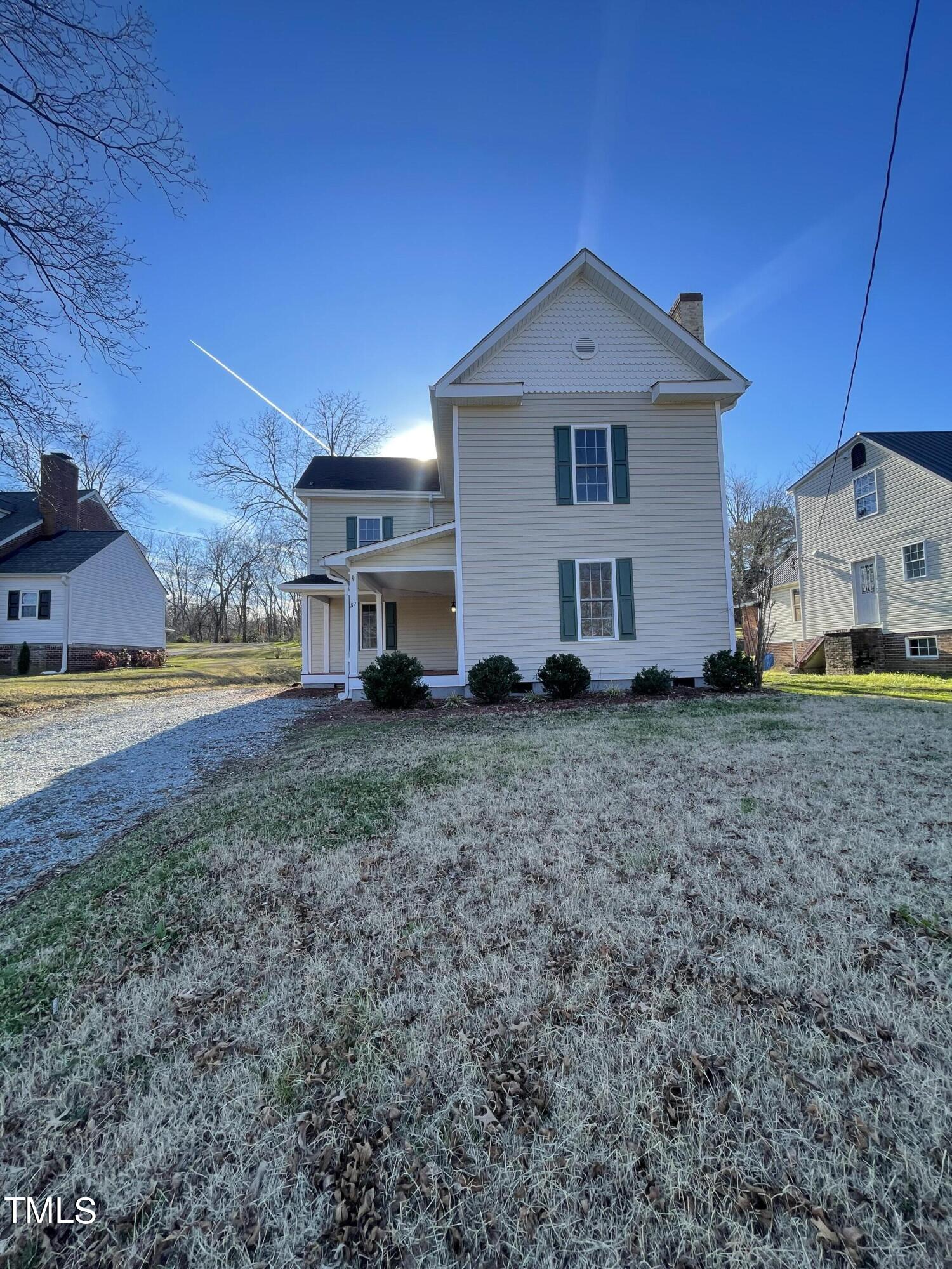 119 Academy Street Roxboro, NC 27573 - Photo 3 of 22 a view of a house with backyard and sitting area