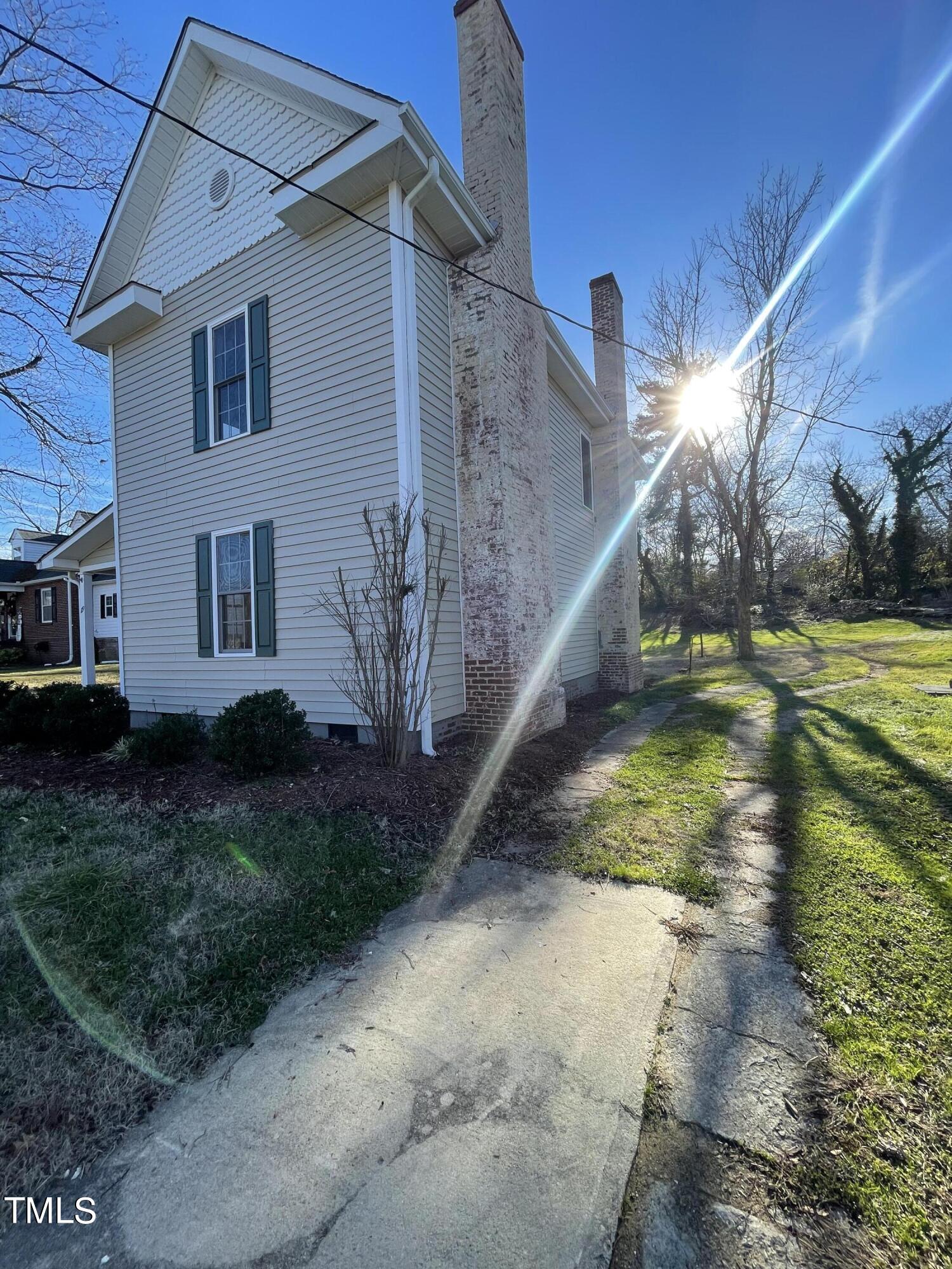 119 Academy Street Roxboro, NC 27573 - Photo 4 of 22 a view of a house with a yard