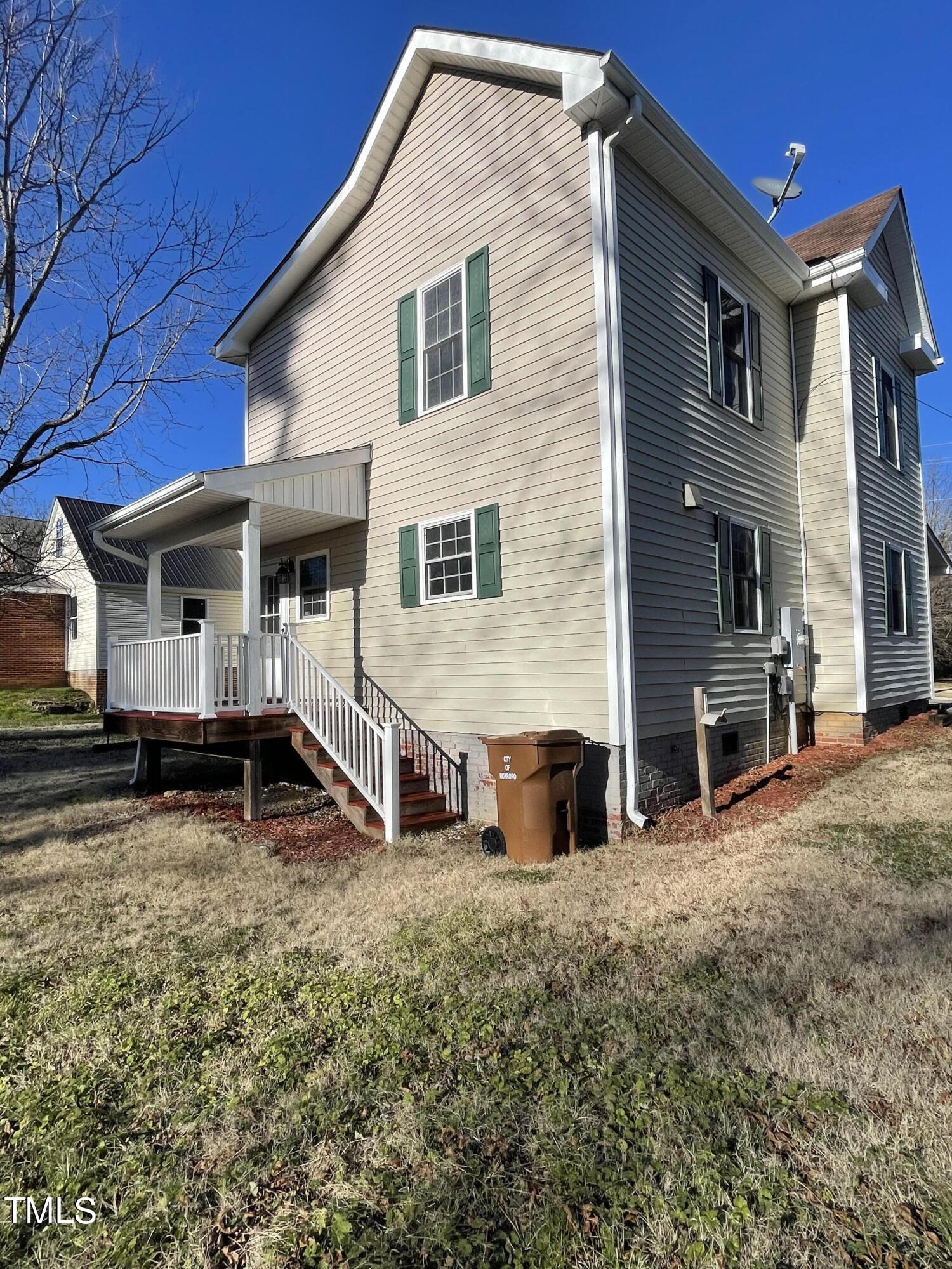 119 Academy Street Roxboro, NC 27573 - Photo 5 of 22 a view of house with backyard