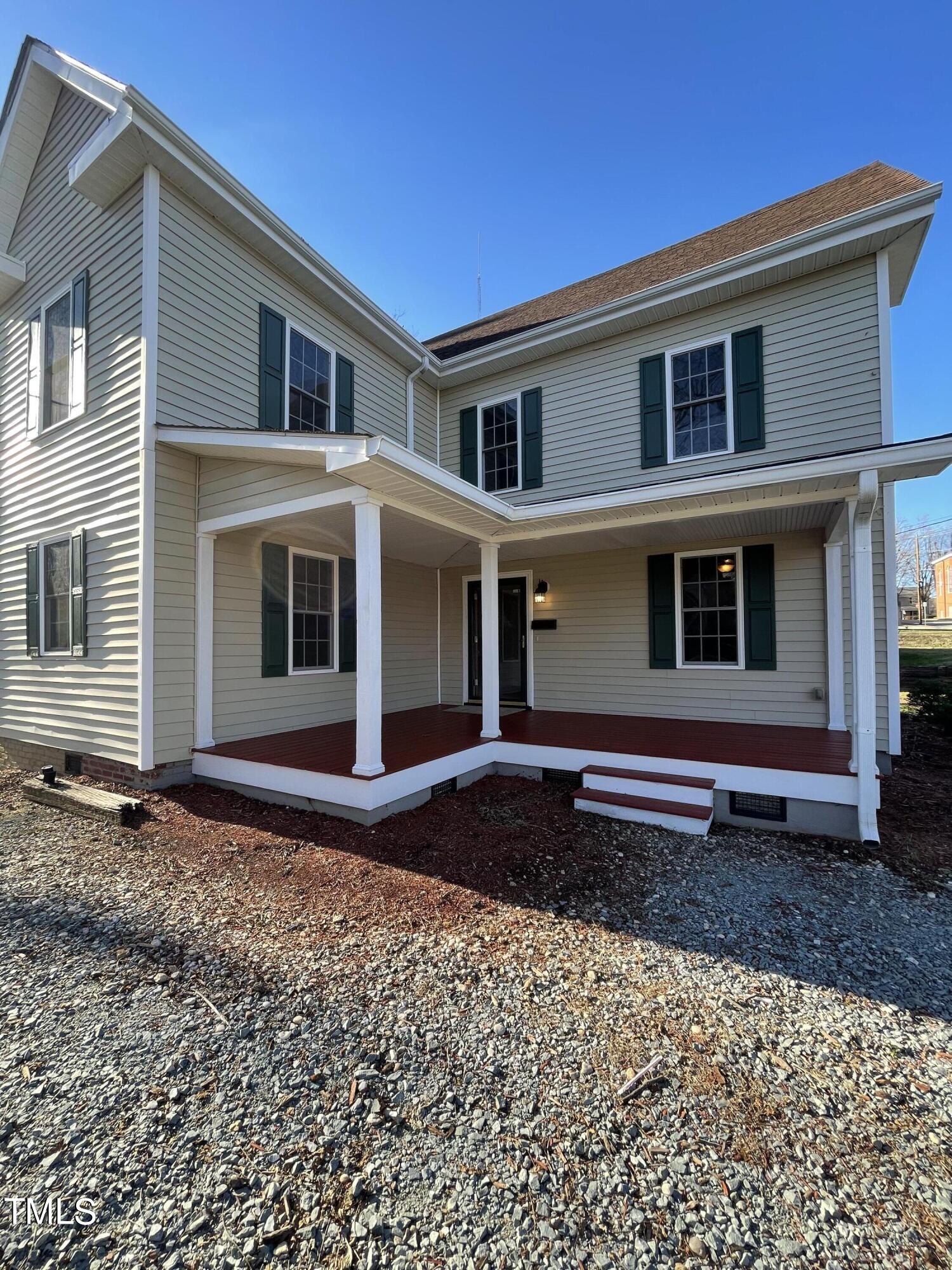 119 Academy Street Roxboro, NC 27573 - Photo 6 of 22 a front view of a house with a yard