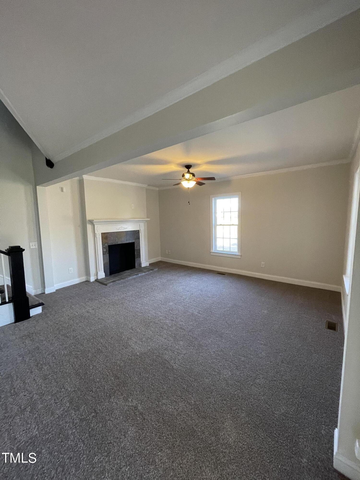 119 Academy Street Roxboro, NC 27573 - Photo 7 of 22 a view of empty room with a fireplace