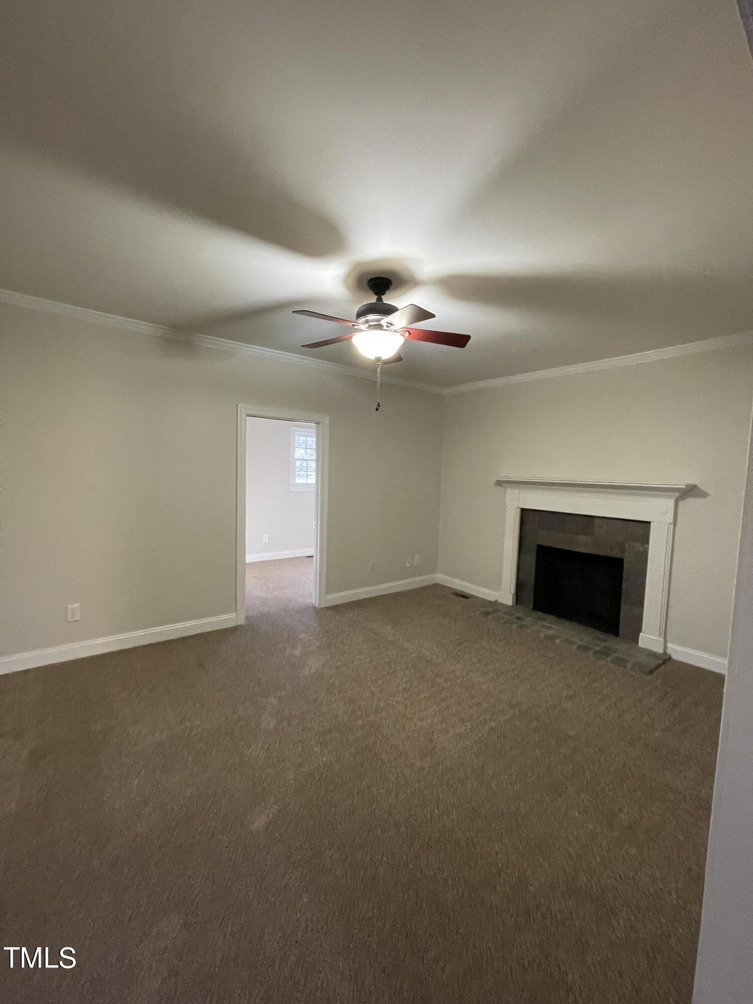 119 Academy Street Roxboro, NC 27573 - Photo 9 of 22 a view of empty room with a fireplace