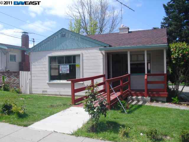 22765 7th Street Hayward, CA 94541 - Photo 1 of 1 a front view of a house with garden