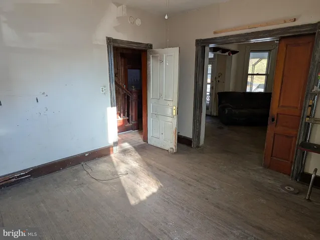 wooden floor and window in an empty room