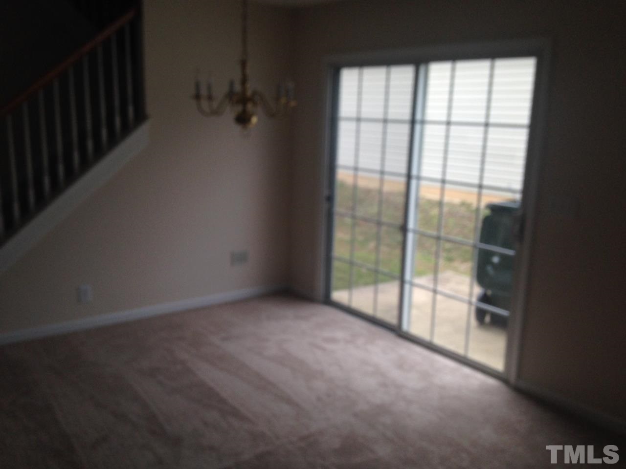 3232 Marcony Way Raleigh, NC 27610 - Photo 3 of 4 a view of a room with sliding glass door