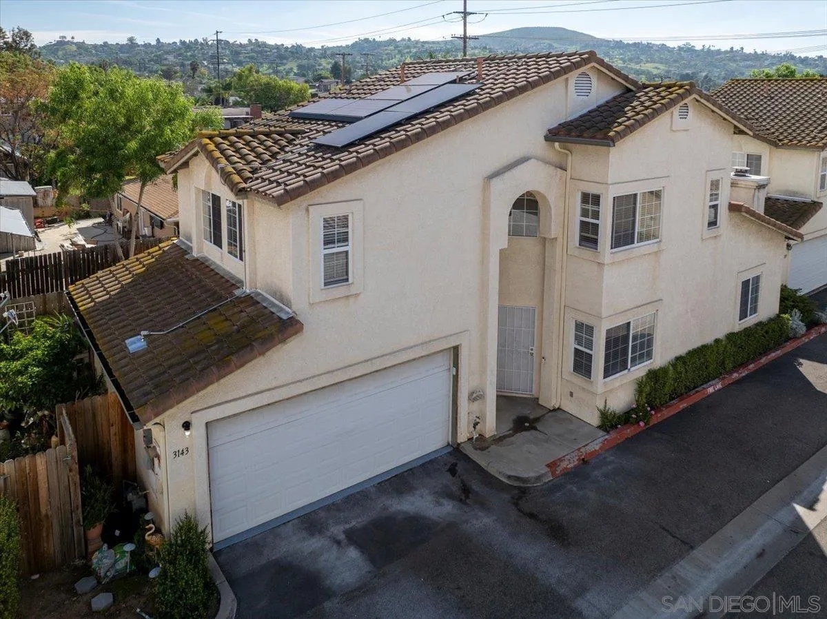 a aerial view of a house with a yard