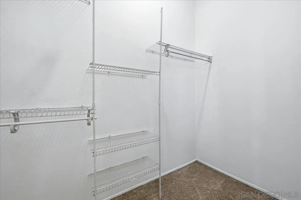 3143 Lamar Court Spring Valley, CA 91977 - Photo 18 of 40 a view of room with racks on the wall