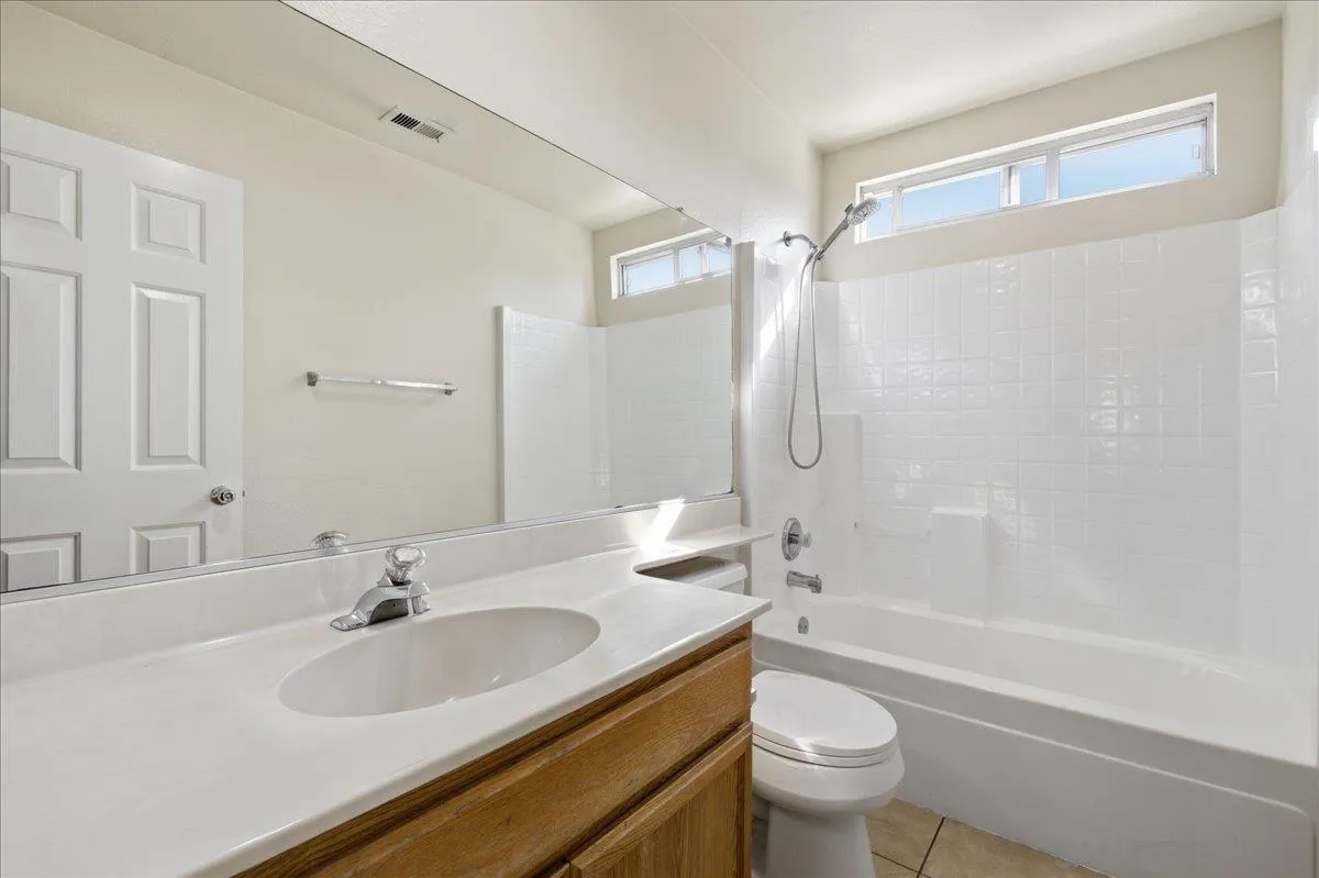 3143 Lamar Court Spring Valley, CA 91977 - Photo 19 of 40 a bathroom with a sink toilet tub and shower