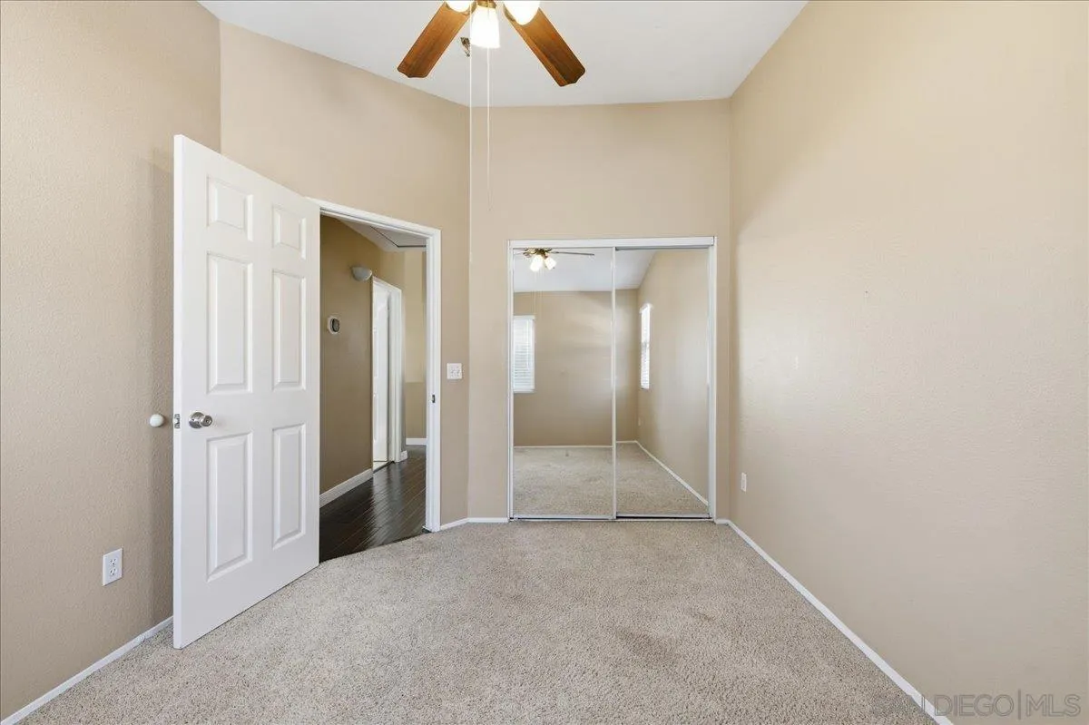 3143 Lamar Court Spring Valley, CA 91977 - Photo 21 of 40 an empty room with fan and entrance