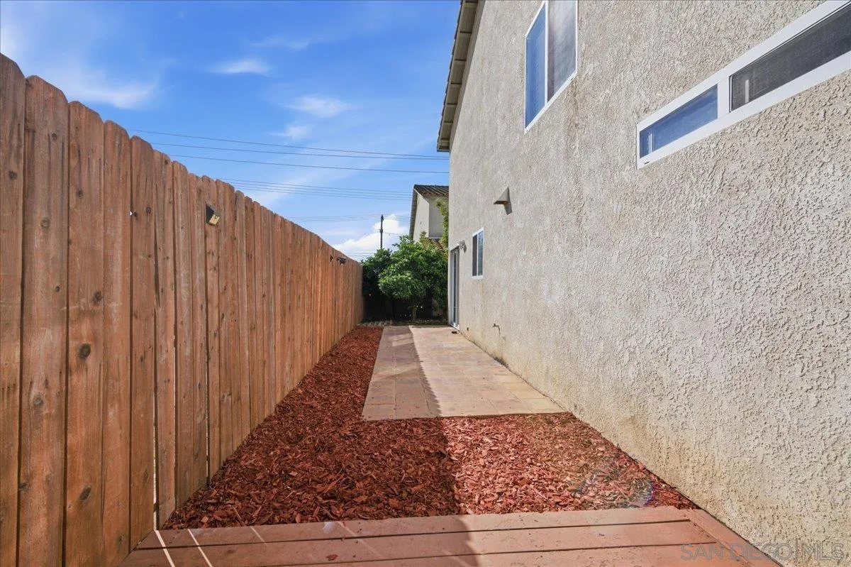 3143 Lamar Court Spring Valley, CA 91977 - Photo 26 of 40 a view of a pathway gate with wooden wall