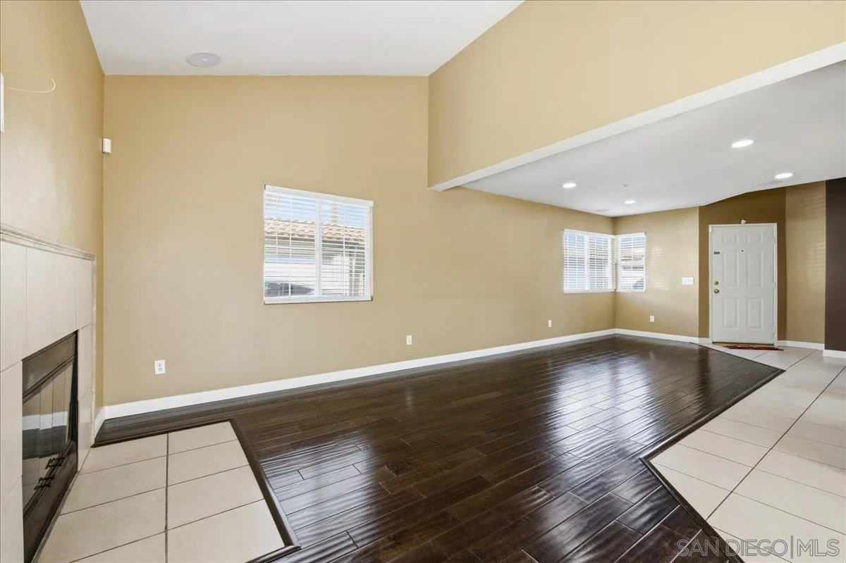 3143 Lamar Court Spring Valley, CA 91977 - Photo 7 of 40 a view of an empty room with window and wooden floor