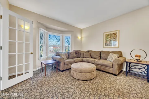 a bedroom with bed and a window