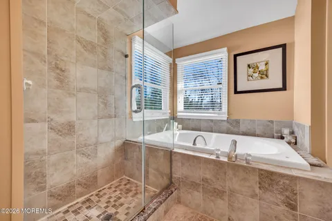 a living room filled with furniture and a flat screen tv