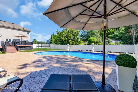 a view of a swimming pool with a patio