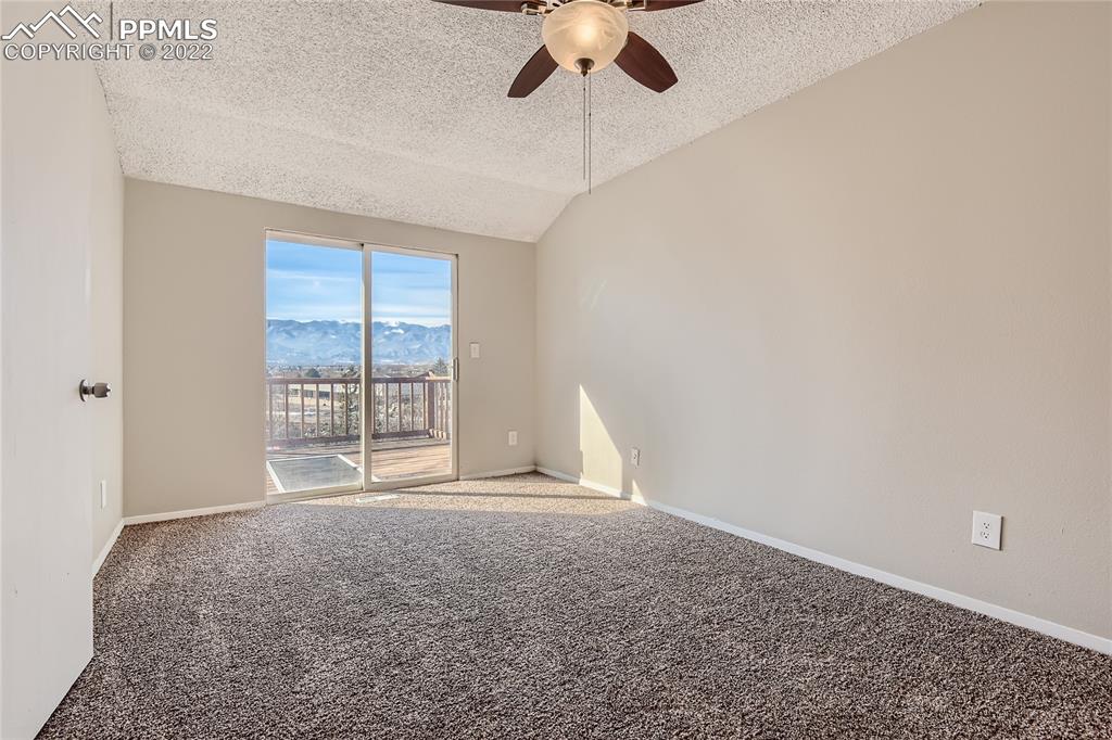 2030 Chelton Road Colorado Springs, CO 80916 - Photo 13 of 33 a view of an empty room with a window