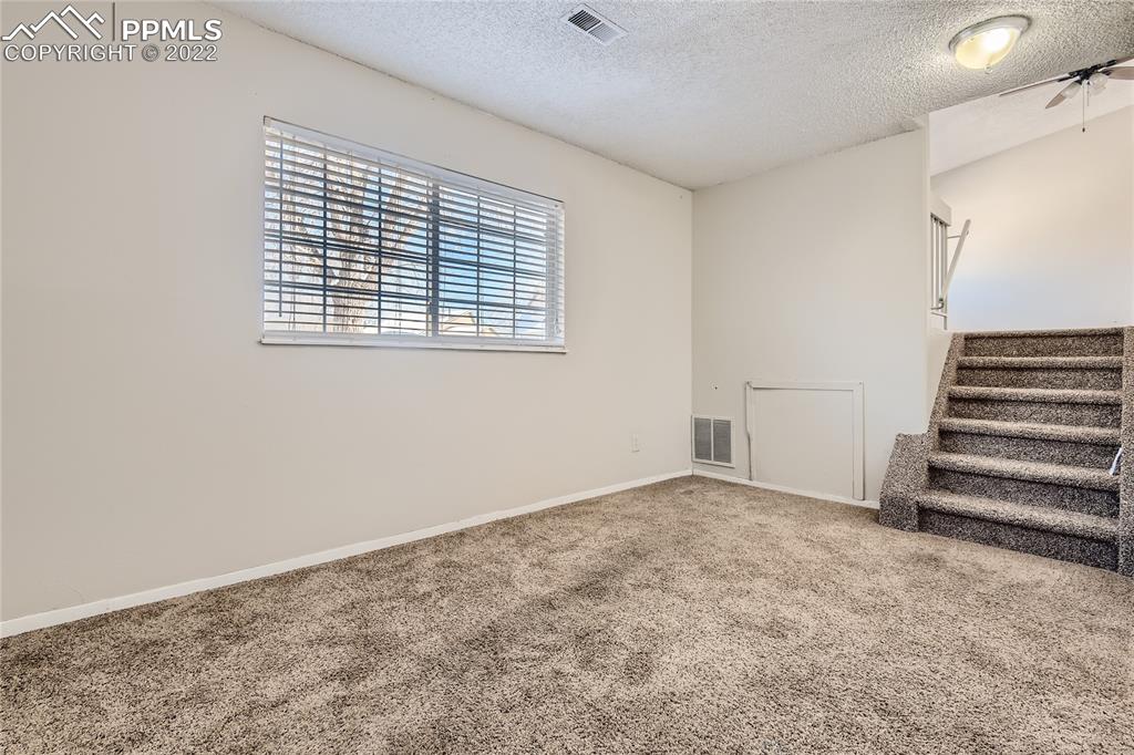 2030 Chelton Road Colorado Springs, CO 80916 - Photo 19 of 33 an empty room with a window