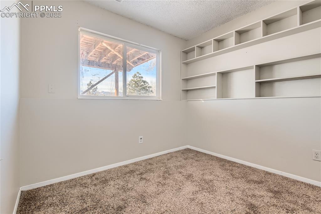 2030 Chelton Road Colorado Springs, CO 80916 - Photo 20 of 33 a view of a room with rack on the wall