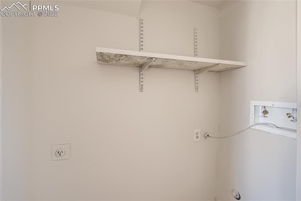 2030 Chelton Road Colorado Springs, CO 80916 - Photo 22 of 33 a view of a room with racks on the wall