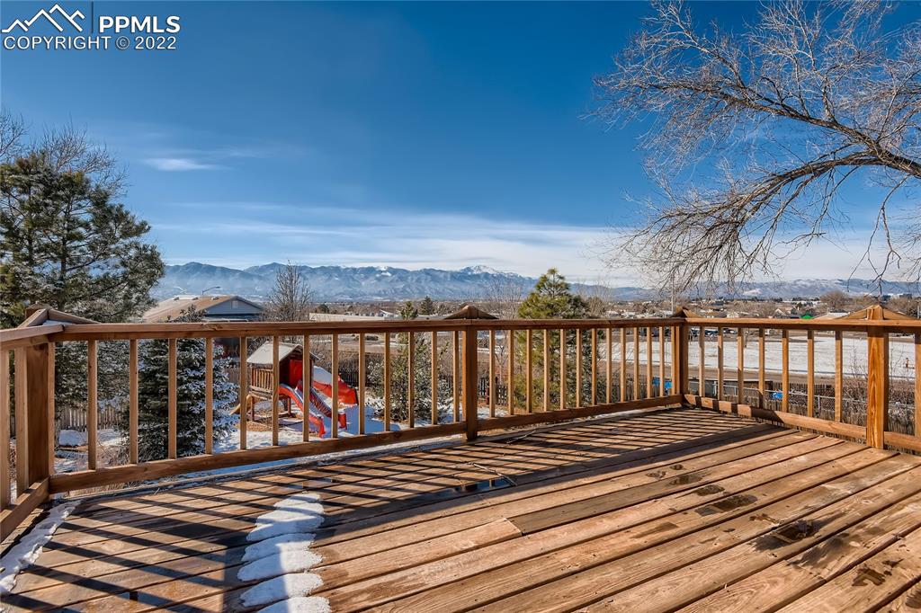 2030 Chelton Road Colorado Springs, CO 80916 - Photo 23 of 33 a view of a balcony with wooden floor