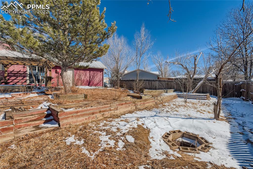 2030 Chelton Road Colorado Springs, CO 80916 - Photo 29 of 33 a view of a backyard of the house
