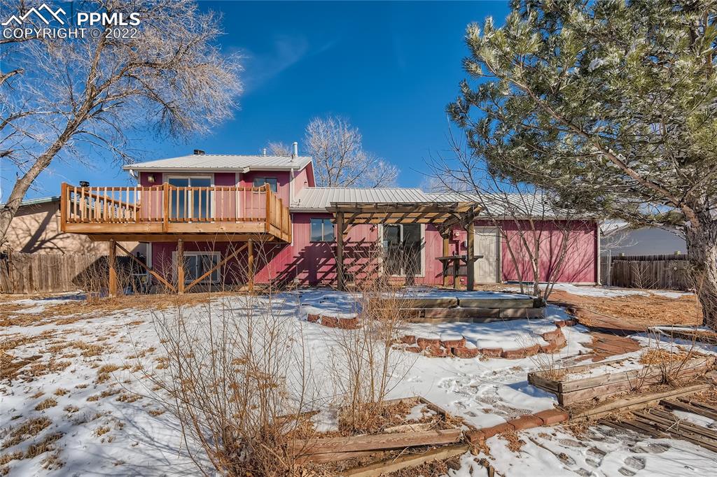 2030 Chelton Road Colorado Springs, CO 80916 - Photo 30 of 33 a view of a house with a yard