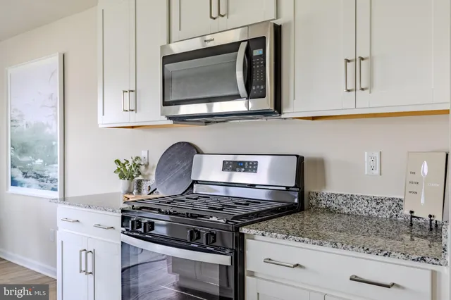 a view of a brick house with a big yard