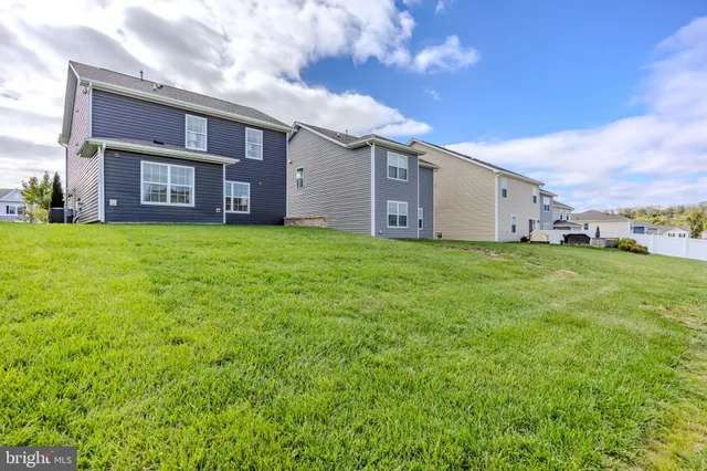 a dining room with furniture and potted plant