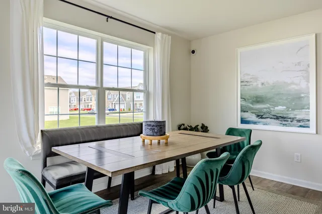 a bathroom with a granite countertop sink toilet a large mirror a bathtub and shower