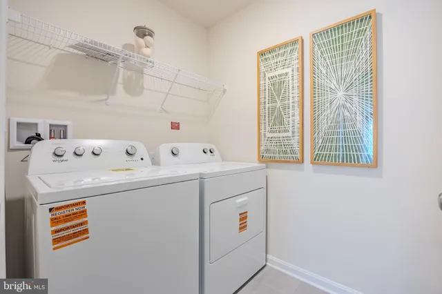 a view of a house with a big yard and large trees