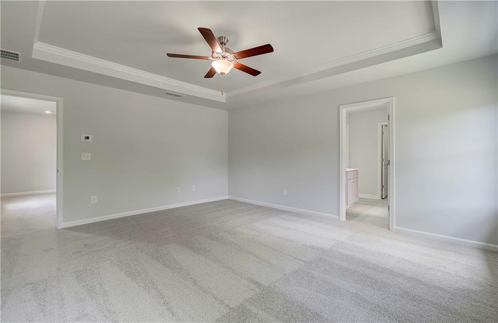 117 Alpine Road Fairburn, GA 30213 - Photo 21 of 29 an empty room with a ceiling fan and a window
