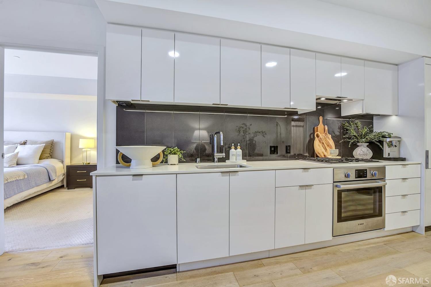 99 Rausch Street, Unit 214 San Francisco, CA 94103 - Photo 20 of 73 a kitchen with white cabinets and sink