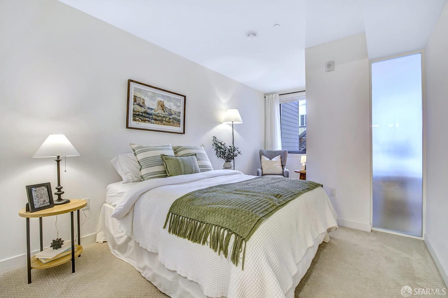 99 Rausch Street, Unit 214 San Francisco, CA 94103 - Photo 21 of 73 a bedroom with a bed and a lamp