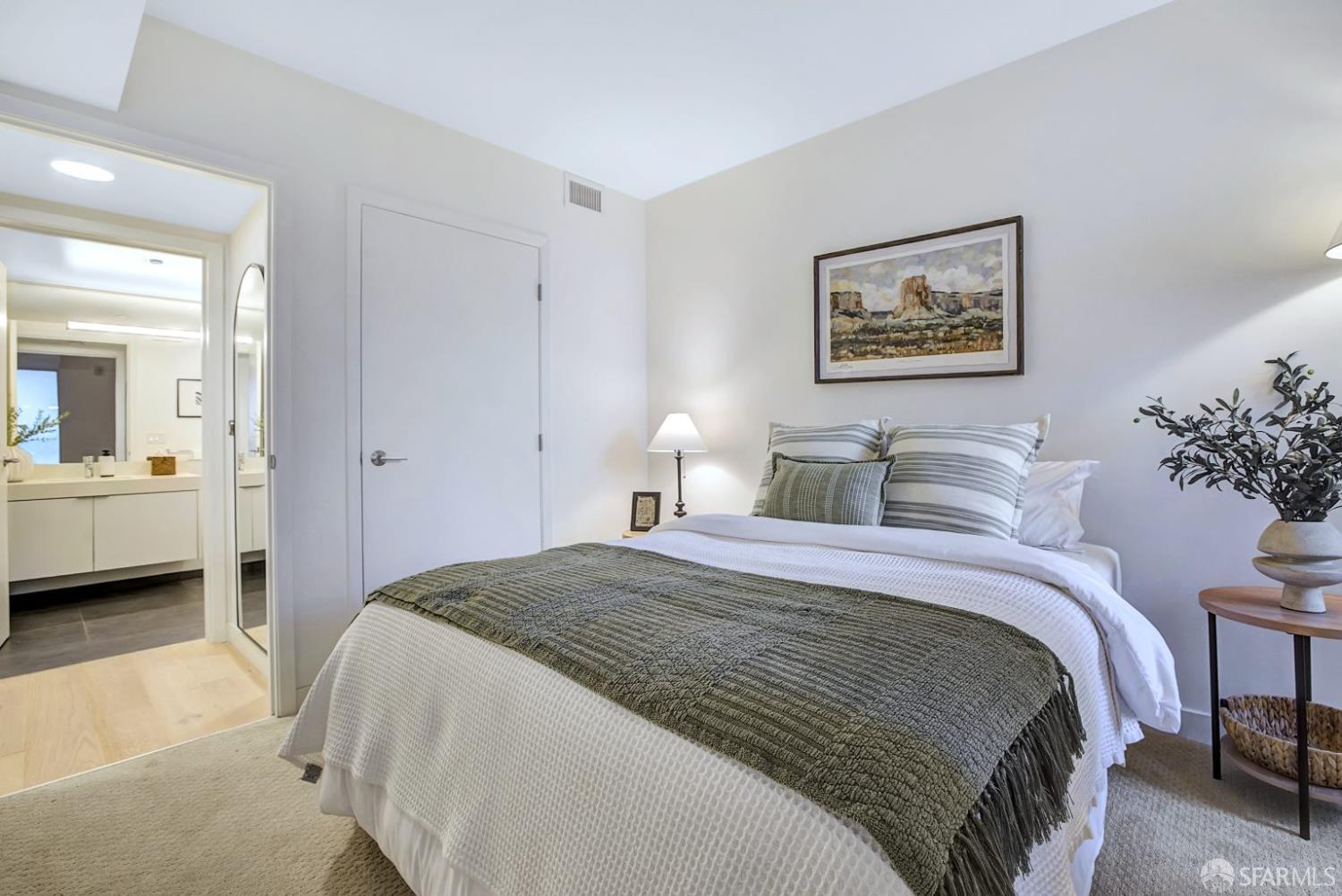 99 Rausch Street, Unit 214 San Francisco, CA 94103 - Photo 24 of 73 a bedroom with bed and a chandelier