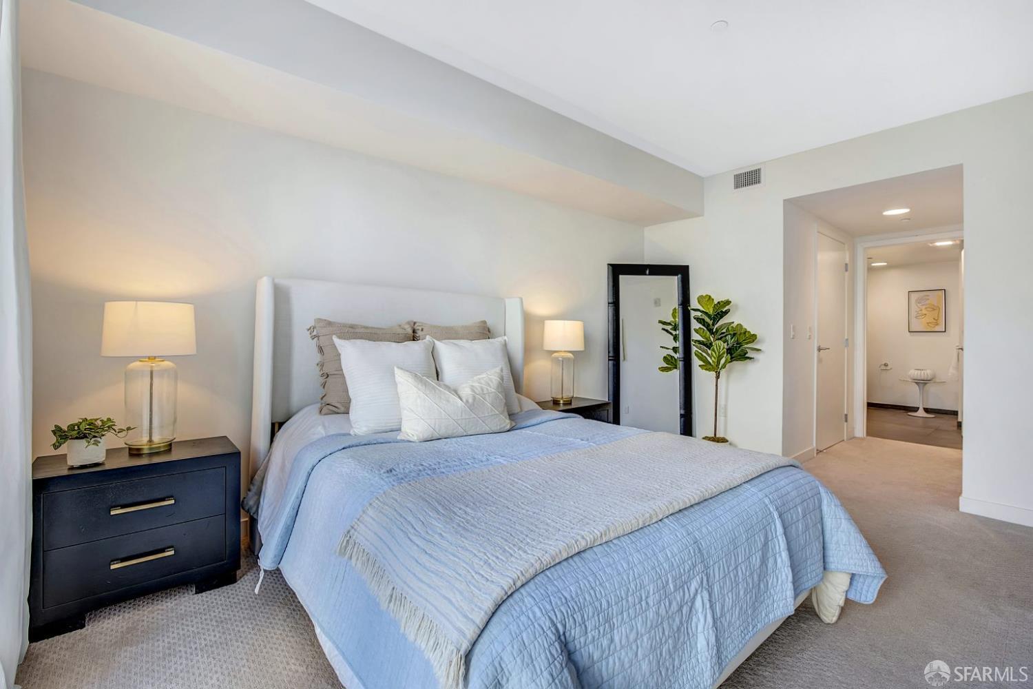 99 Rausch Street, Unit 214 San Francisco, CA 94103 - Photo 31 of 73 a bedroom with a bed and a potted plant