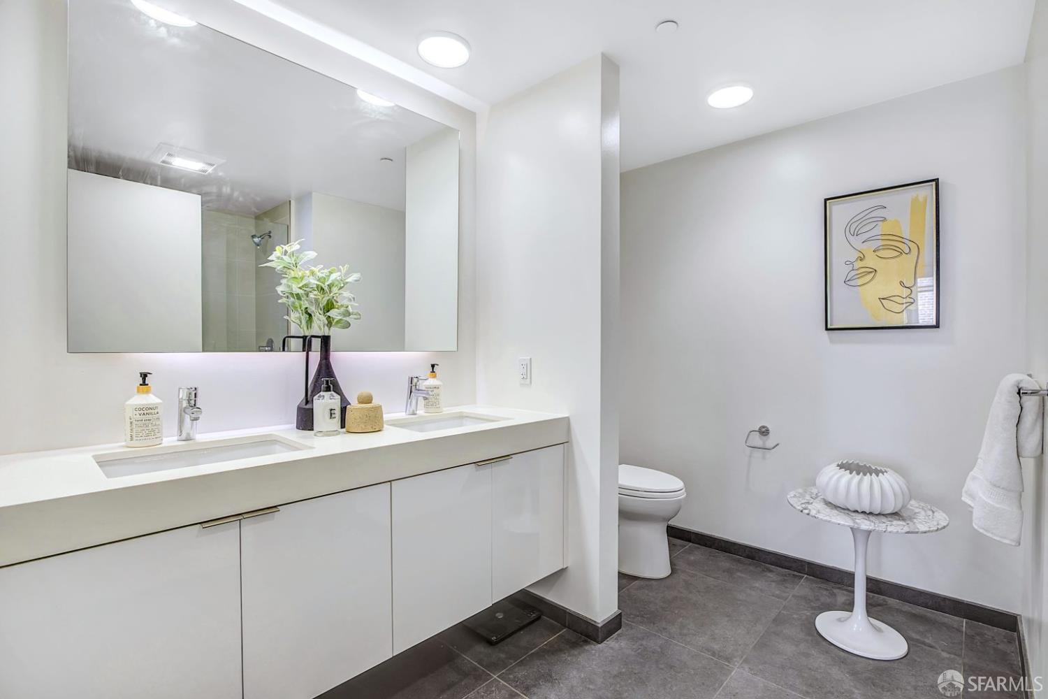 99 Rausch Street, Unit 214 San Francisco, CA 94103 - Photo 33 of 73 a bathroom with a toilet sink and mirror
