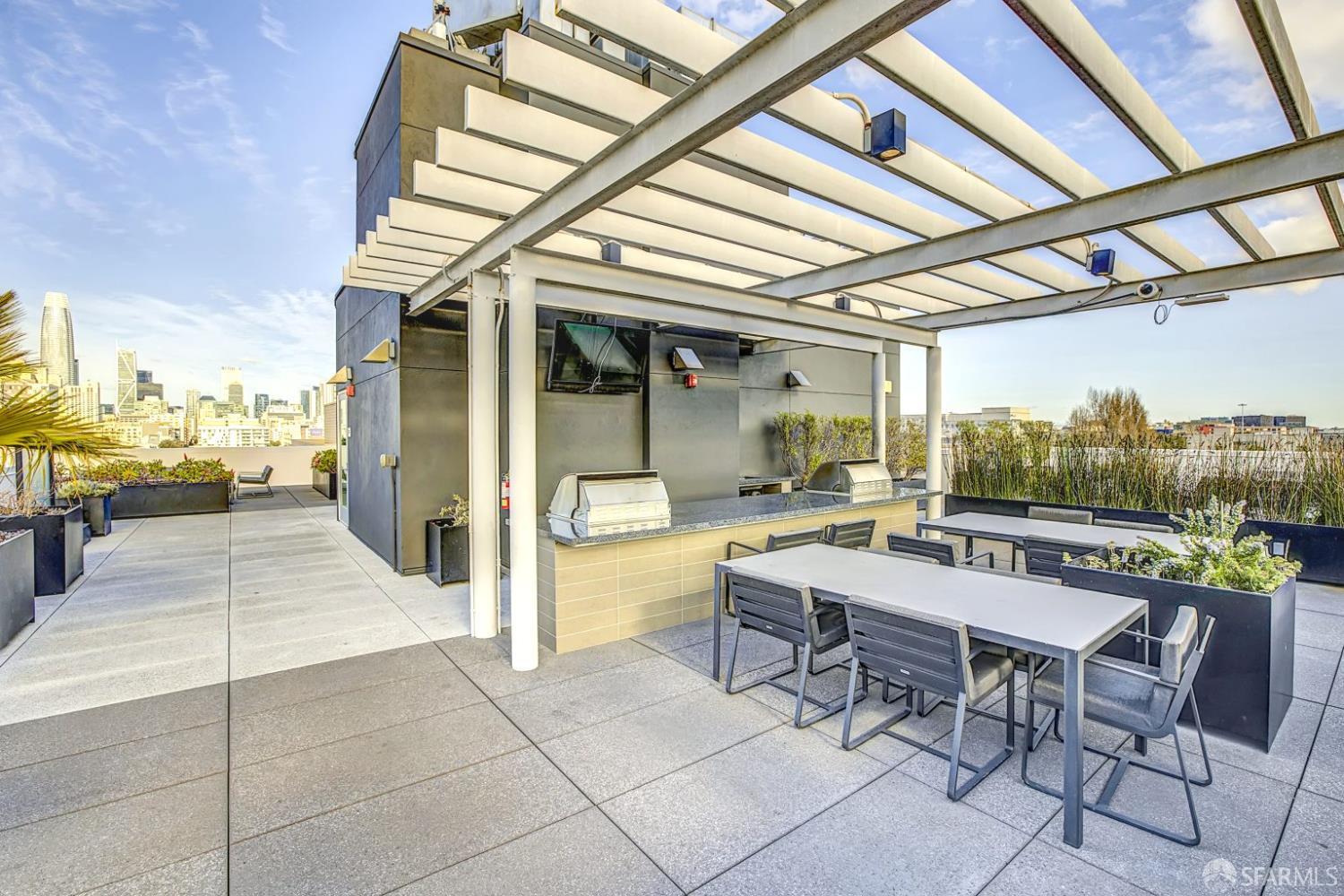 99 Rausch Street, Unit 214 San Francisco, CA 94103 - Photo 55 of 73 a view of a patio with a table and chairs and couches