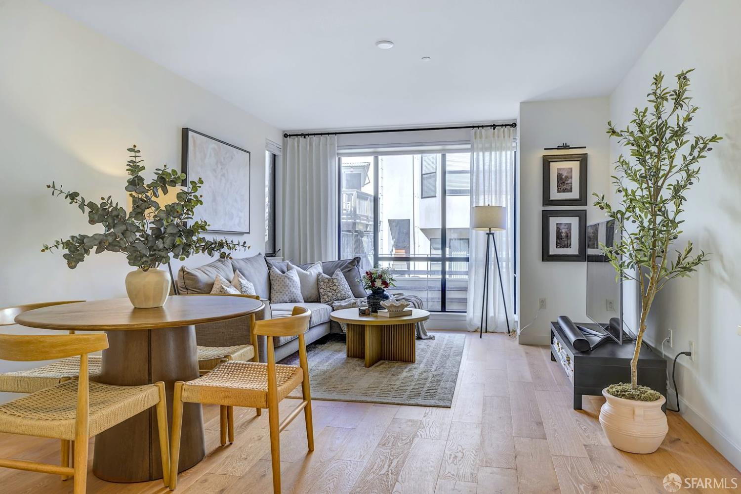 99 Rausch Street, Unit 214 San Francisco, CA 94103 - Photo 9 of 73 a living room with furniture and wooden floor