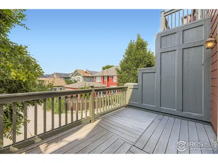 a view of a balcony with wooden floor