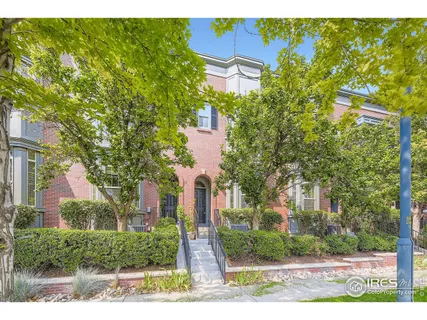 front view of a house with a tree
