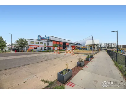 a view of multiple houses with city street