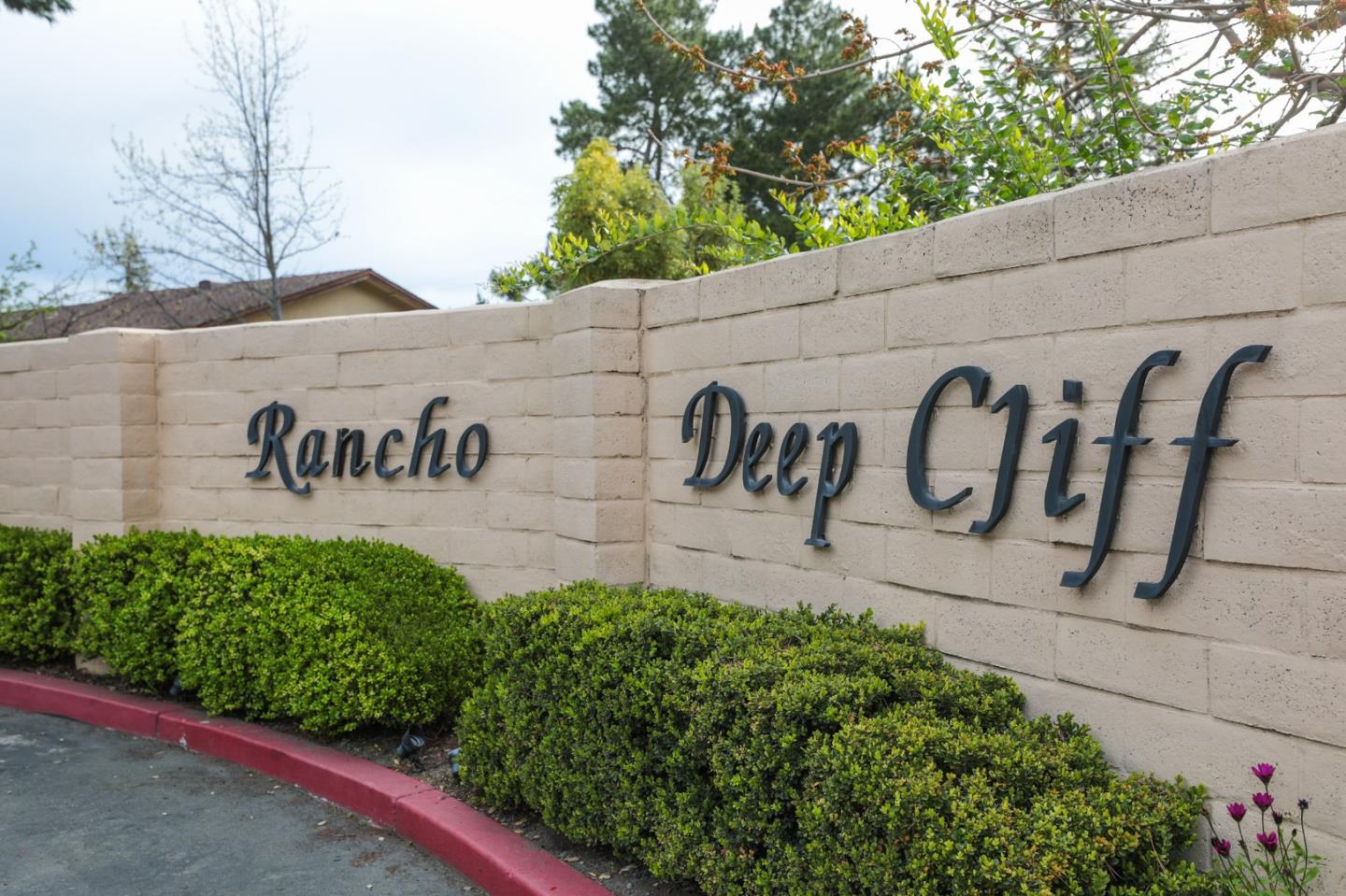 22415 Rancho Deep Cliff Drive Cupertino, CA 95014 - Photo 33 of 33 a sign that is on a brick wall