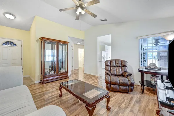 a living room with furniture and a window
