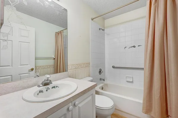 a view of a lake with a building in the background