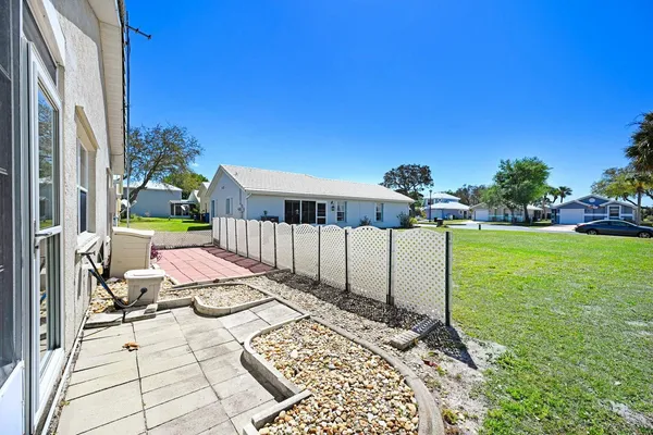 a view of a balcony with two chairs and a table