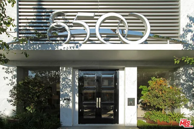 a front view of a house with outdoor space