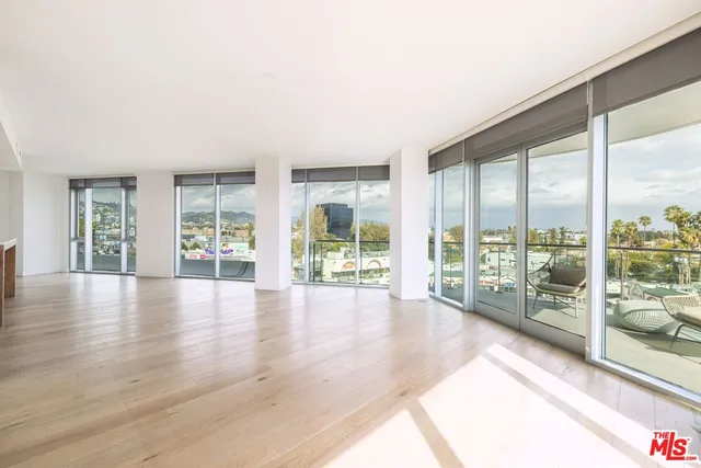 a view of room with window and wooden floor