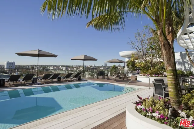 a view of a swimming pool with a patio