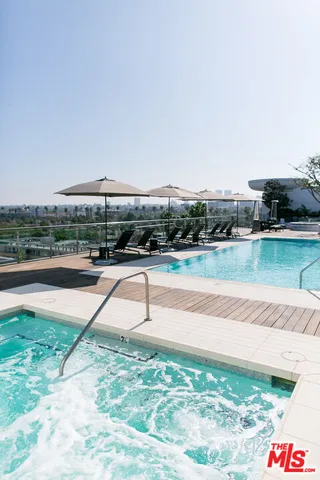 a view of a swimming pool with a yard