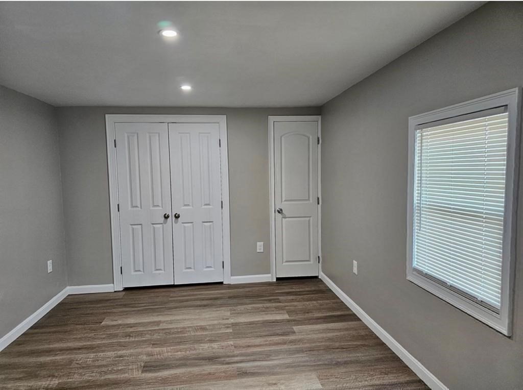 495 Chicago Street Fall River, MA 02721 - Photo 12 of 23 a view of a hallway with wooden floor