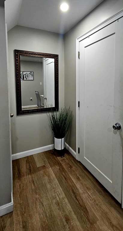 495 Chicago Street Fall River, MA 02721 - Photo 15 of 23 a view of a hallway with wooden floor and a potted plant